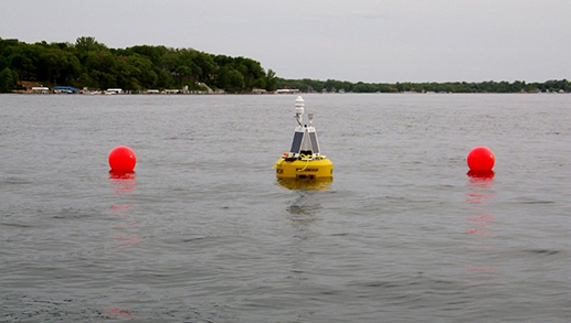 A hydrological buoy floats in 90 feet of water west of Sunset Beach
on West Lake Okoboji. The buoy collects and relays environmental
information about the lakes water quality every 10 minutes.