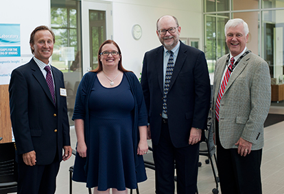 Kelli Ryckman poses with (from left) Dr. Michael Schultz, 2015 – 2016 Hygienic Lab Public Health Ambassador; Dan Reed, University of Iowa vice president of Research and Development; and State Hygienic Laboratory Director Christopher Atchison.  Ryckman is the 2016 – 2017 Public Health Ambassador and newly named Policy Fellow for the Iowa Institute of Public Health Research and Policy.