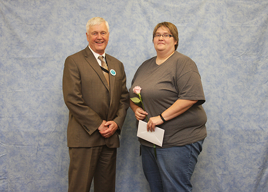 20 years of service: Becky Teske, with Director Atchison