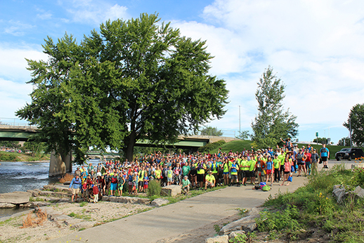 A group of AWARE volunteers gather on the banks of the upper Cedar River.