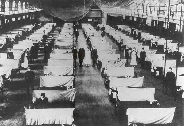 Iowa patients suffering from influenza-related illnesses in 1918 are treated in a makeshift hospital in the Iowa State College (later named Iowa State University) gymnasium. 